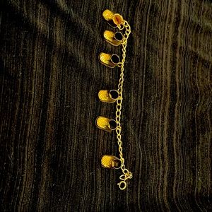 Vintage 10k gold filled bracelet with 6 baby bootie charms.